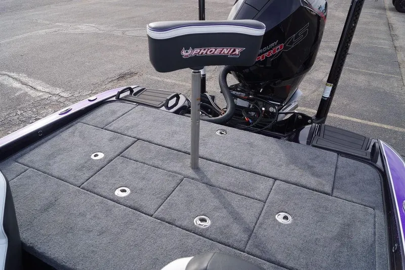 Slide: The Image of 2026 Phoenix 21 XE boat deck with seat and motor, featuring gray carpeting. - 14