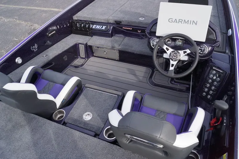 Slide: The Image of 2026 Phoenix 21 XE boat interior with Garmin navigation, dual seats, and modern dashboard. - 16
