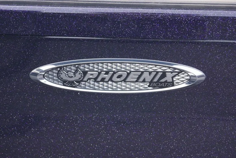 Slide: The Image of Phoenix 21 XE 2026 boat logo on a sparkling dark surface. - 25