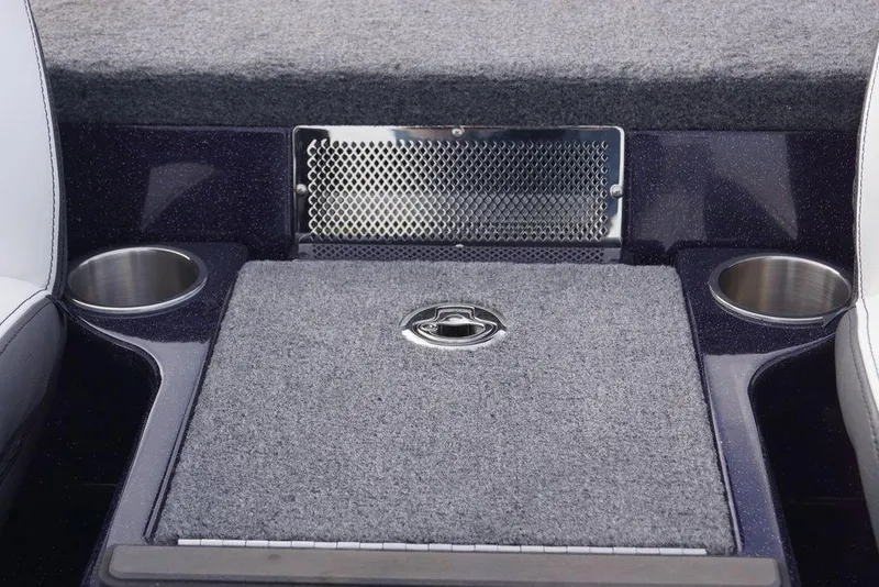 Slide: The Image of Phoenix 21 XE 2026 boat interior with carpeted flooring and cup holders. - 30