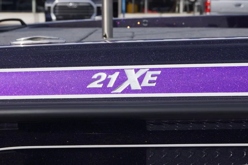 Slide: The Image of 2026 Phoenix 21 XE boat with purple glitter finish and model branding. - 7