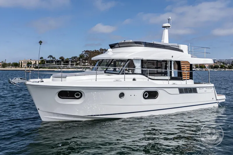 The Image of 2026 Beneteau Swift Trawler 41 Fly cruising on calm waters, showcasing sleek design. - 0