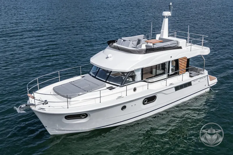 Slide: The Image of 2026 Beneteau Swift Trawler 41 Fly cruising on open water, showcasing sleek design and spacious deck. - 11