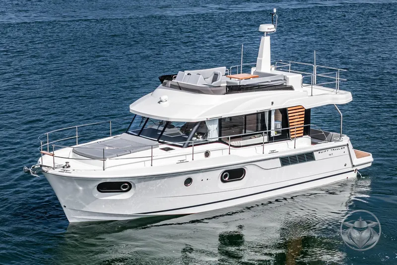 Slide: The Image of 2026 Beneteau Swift Trawler 41 Fly cruising on calm blue waters. - 12