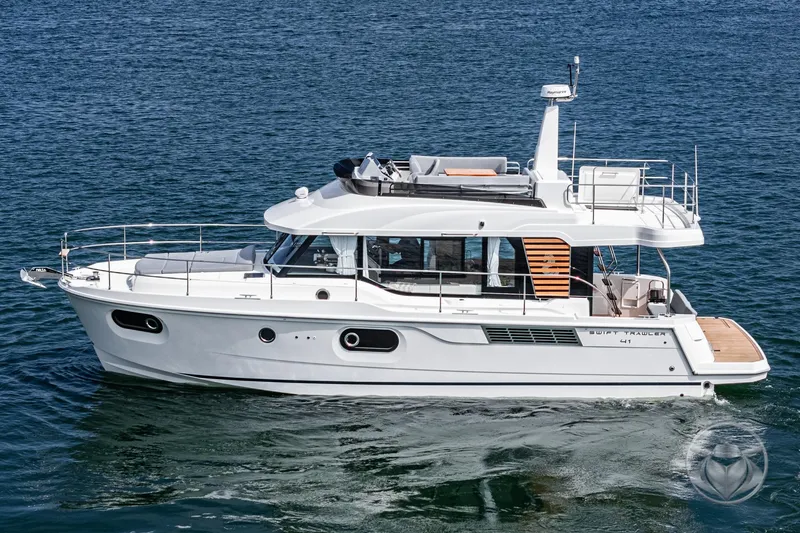Slide: The Image of 2026 Beneteau Swift Trawler 41 Fly cruising on open water. - 17