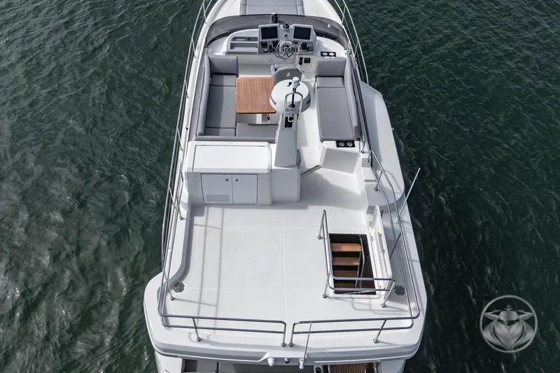 Slide: The Image of 2026 Beneteau Swift Trawler 41 Fly, aerial view of spacious flybridge and helm. - 2
