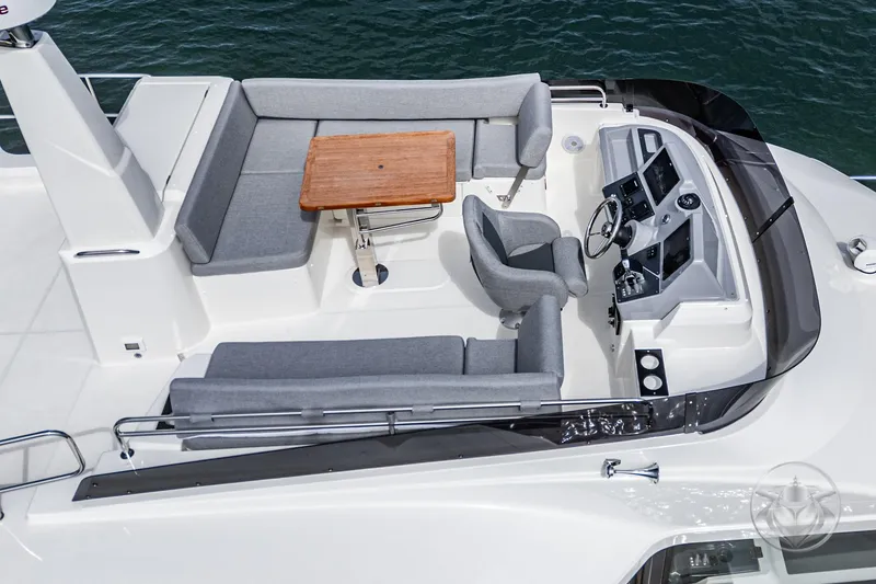 Slide: The Image of 2026 Beneteau Swift Trawler 41 Flybridge with seating and helm, aerial view. - 30