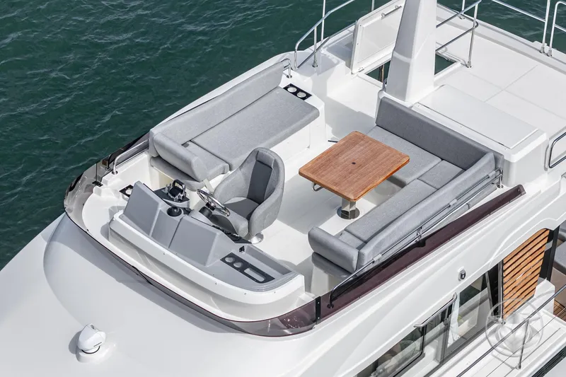 Slide: The Image of 2026 Beneteau Swift Trawler 41 Fly, flybridge view with seating and helm station. - 33