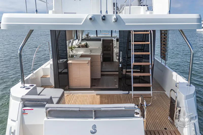 Slide: The Image of 2026 Beneteau Swift Trawler 41 Fly, spacious deck and modern interior on the water. - 38