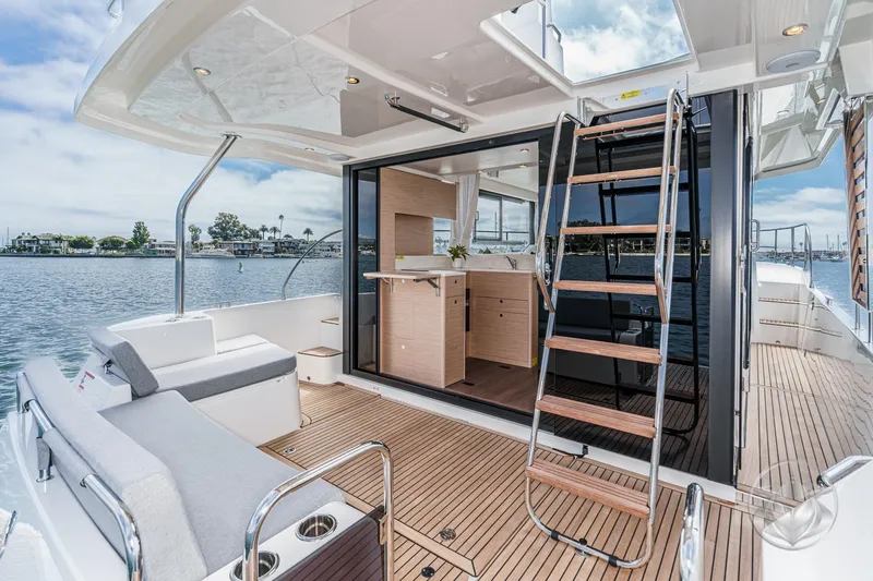 Slide: The Image of 2026 Beneteau Swift Trawler 41 Fly, elegant deck view with modern interior. - 40
