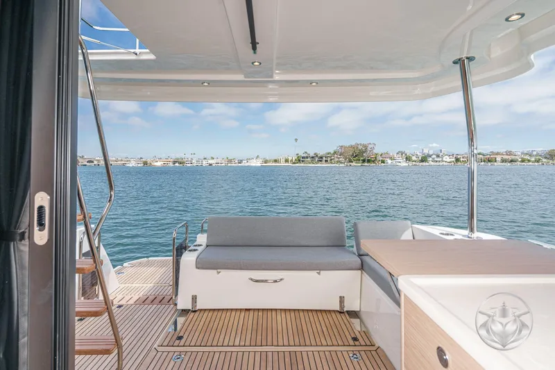 Slide: The Image of 2026 Beneteau Swift Trawler 41 Fly, elegant deck view over serene waters. - 41