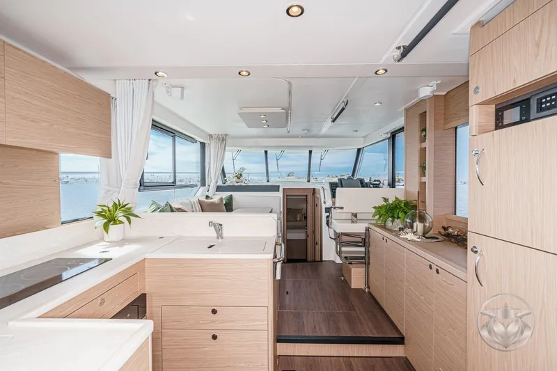 Slide: The Image of Luxurious interior of 2026 Beneteau Swift Trawler 41 Fly with modern design and panoramic windows. - 44