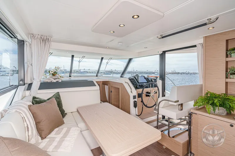 Slide: The Image of Luxurious interior of 2026 Beneteau Swift Trawler 41 Fly with modern helm and seating. - 5