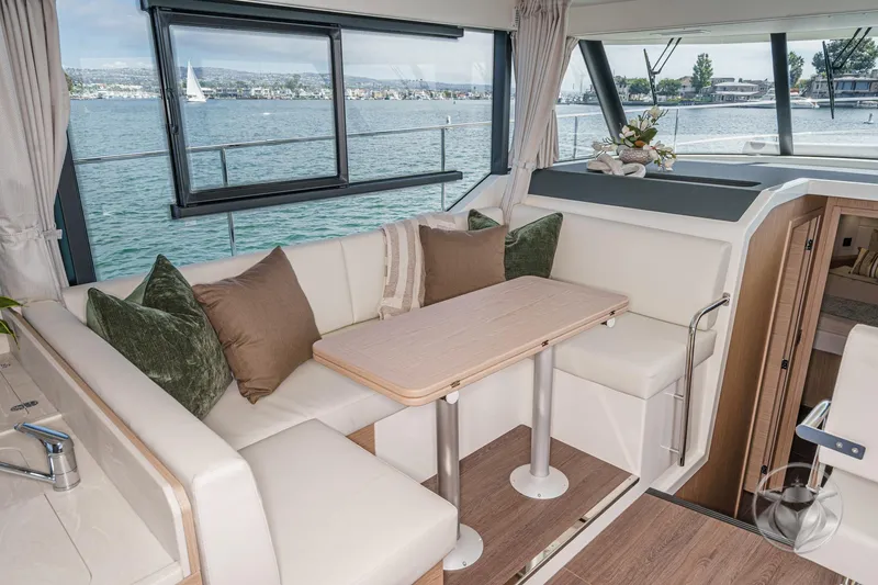 Slide: The Image of 2026 Beneteau Swift Trawler 41 Fly interior with elegant seating and scenic water view. - 53