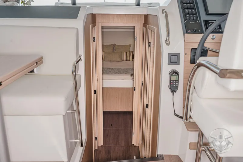 Slide: The Image of Interior view of 2026 Beneteau Swift Trawler 41 Fly, featuring modern cabin design. - 61