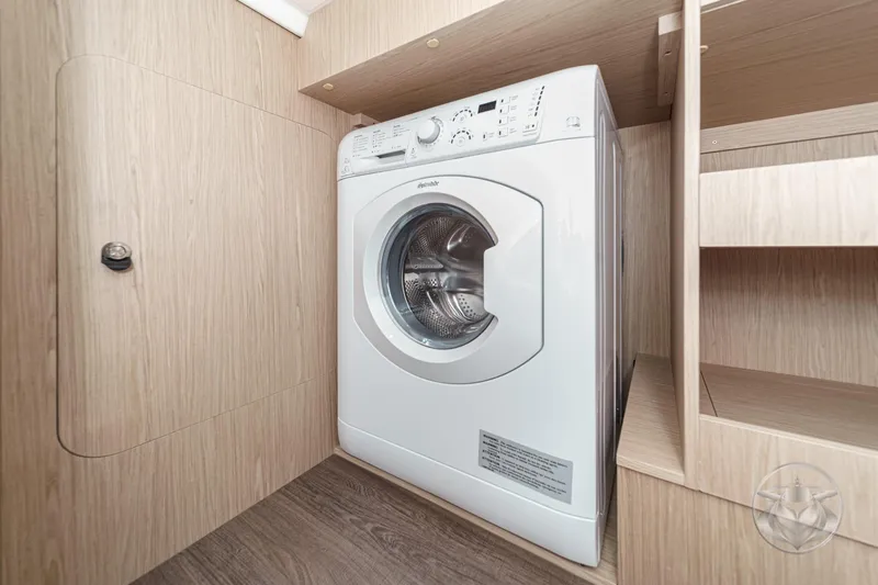 Slide: The Image of Washing machine in 2026 Beneteau Swift Trawler 41 Fly, wooden interior. - 69