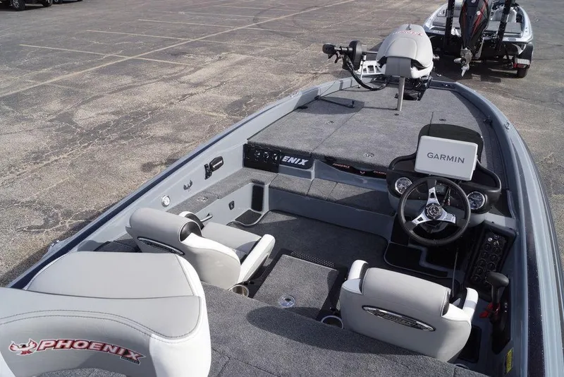Slide: The Image of 2026 Phoenix 819 ZXL boat interior with Garmin navigation system, featuring sleek seating and controls. - 10