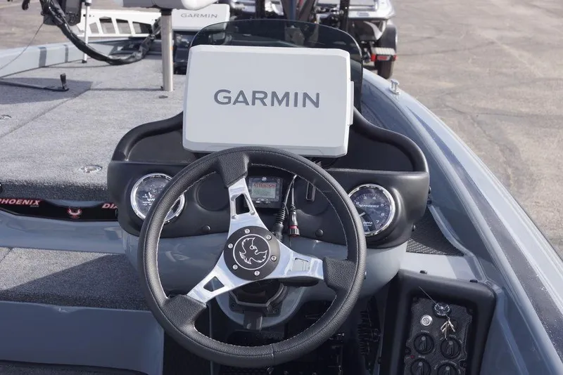 Slide: The Image of Steering console of 2026 Phoenix 819 ZXL boat with Garmin navigation system. - 15