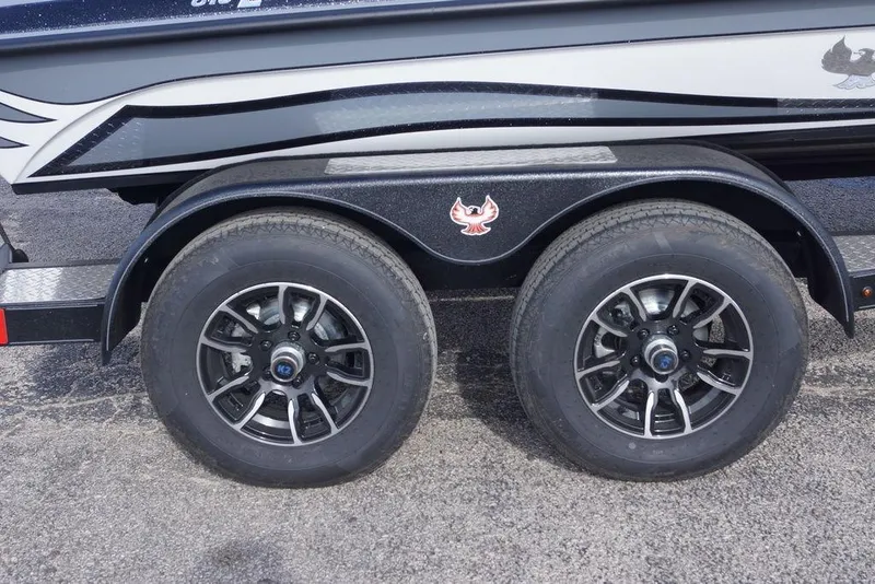 Slide: The Image of 2026 Phoenix 819 ZXL trailer with dual black alloy wheels and sleek design. - 2