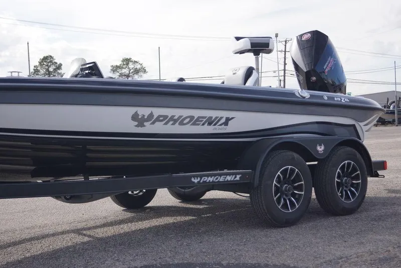 Slide: The Image of 2026 Phoenix 819 ZXL boat on trailer, showcasing sleek design and modern features. - 3