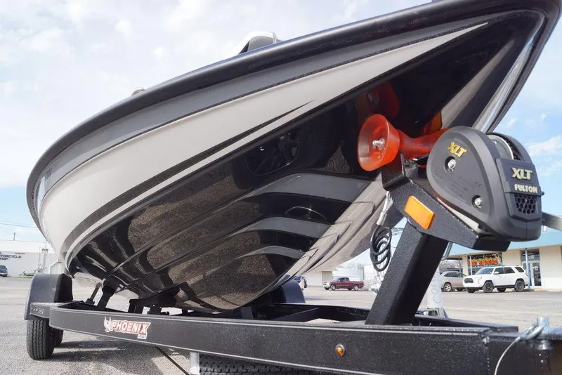 Slide: The Image of 2026 Phoenix 819 ZXL boat on trailer, showcasing sleek design and modern features. - 7