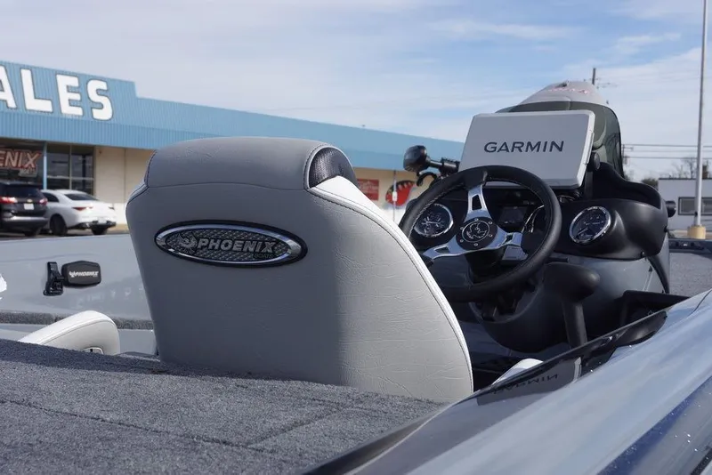 Slide: The Image of 2026 Phoenix 819 ZXL boat interior with Garmin navigation system at dealership. - 8