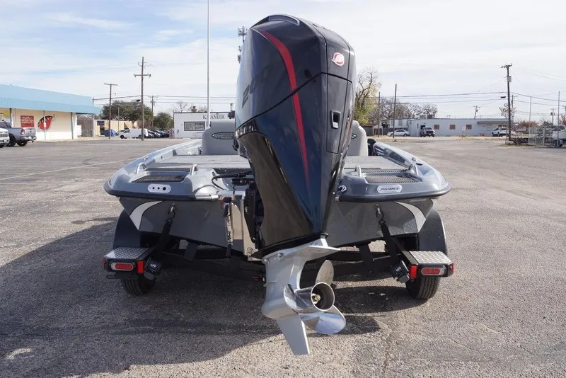 Slide: The Image of 2026 Phoenix 819 ZXL boat with powerful outboard motor in a parking lot. - 9