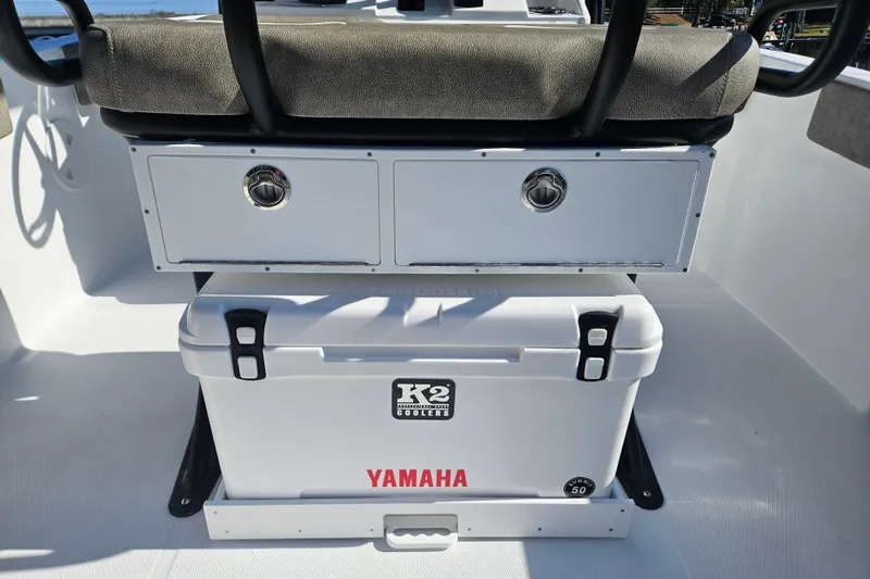 Slide: The Image of 2026 Sea Hunt Ultra 229 boat interior with K2 cooler and Yamaha branding. - 13