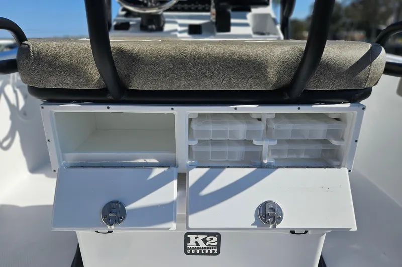 Slide: The Image of Storage compartments on a 2026 Sea Hunt Ultra 229 boat with K2 coolers. - 14