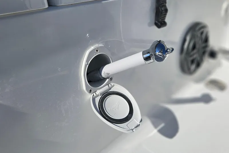 Slide: The Image of Close-up of a 2026 Sea Hunt Ultra 229 boat's water hose connection. - 19