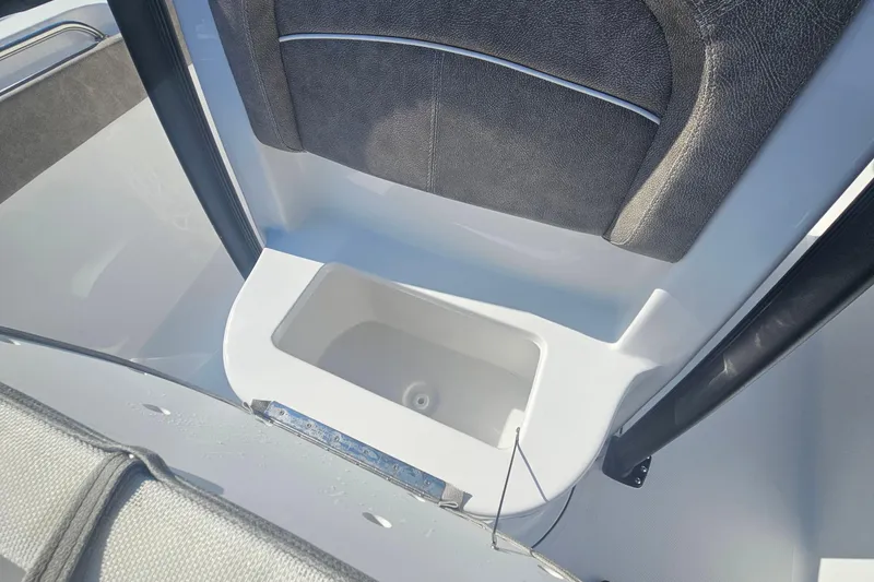 Slide: The Image of Interior view of 2026 Sea Hunt Ultra 229 boat, featuring a storage compartment. - 24