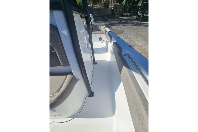 Slide: The Image of 2026 Sea Hunt Ultra 229 boat interior with seating and sleek design. - 25