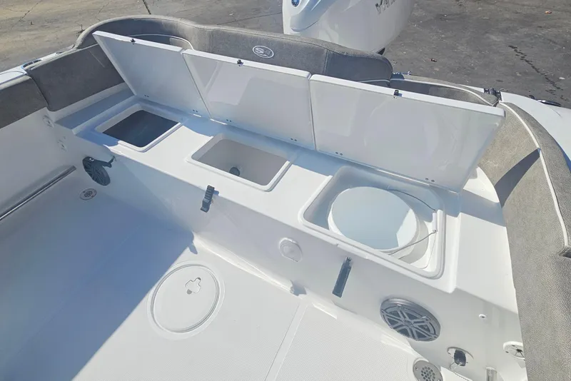 Slide: The Image of 2026 Sea Hunt Ultra 229 boat interior with storage compartments and seating. - 8