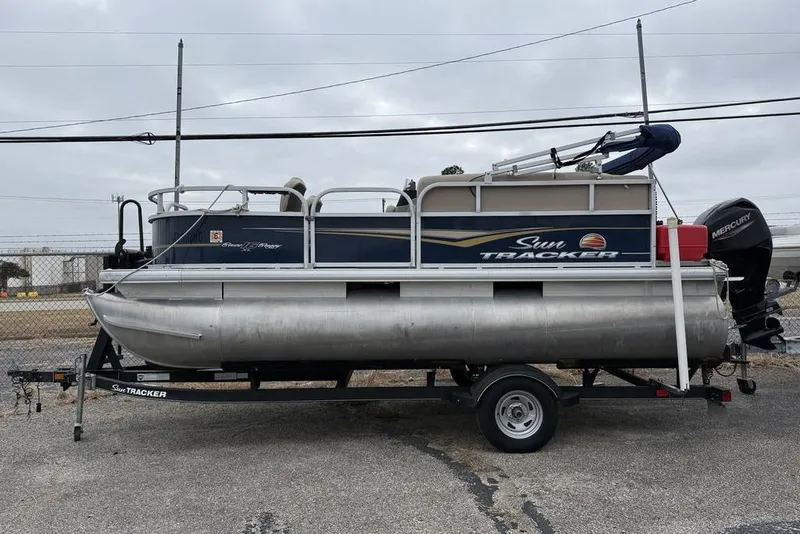 The Image of Pontoon boat on trailer, overcast sky, Phoenix 920 Elite X, 2026 model. - 1