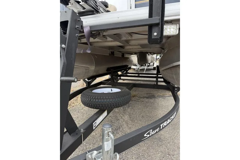 Slide: The Image of Underneath view of a 2026 Phoenix 920 Elite X boat trailer with spare tire. - 5