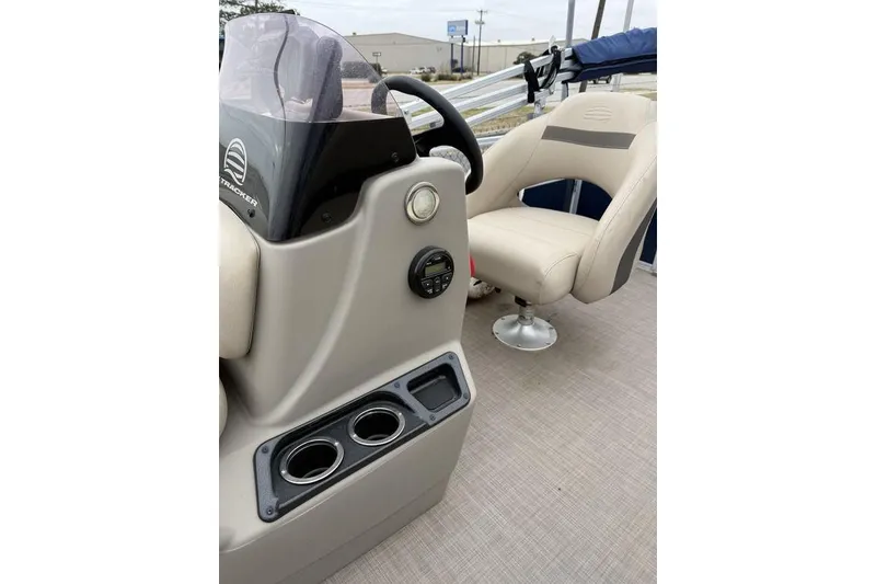 Slide: The Image of 2026 Phoenix 920 Elite X boat interior with steering console and comfortable seating. - 8