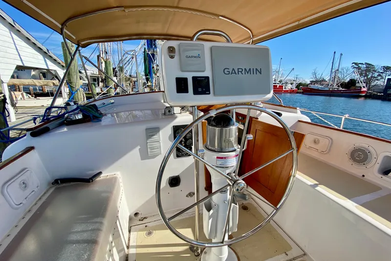Slide: The Image of Cockpit of 1980 Wellington 44 sailboat with Garmin navigation system, docked at marina. - 17