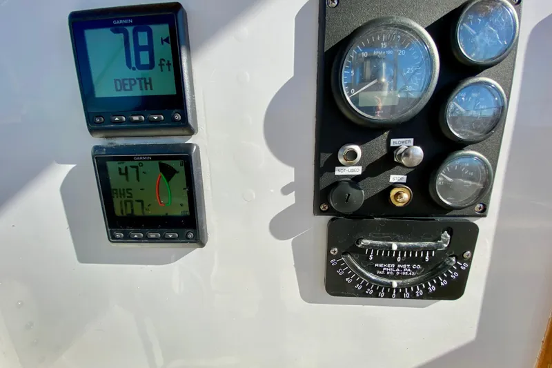 Slide: The Image of Control panel of a 1980 Wellington 44 boat with depth and angle gauges. - 20