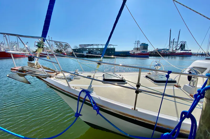 Slide: The Image of Sailboat docked in sunny marina, Wellington 44 model, 1980. - 3