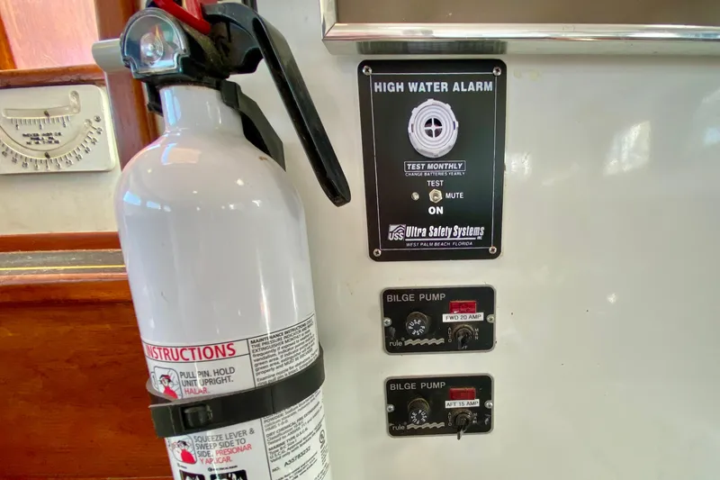 Slide: The Image of Fire extinguisher and high water alarm panel on 1980 Wellington 44 boat. - 30