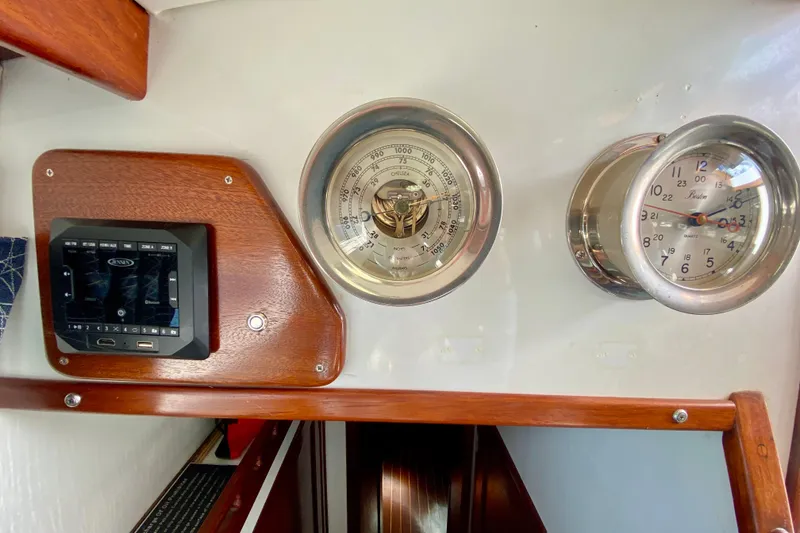 Slide: The Image of Control panel and gauges inside a 1980 Wellington 44 boat cabin. - 31