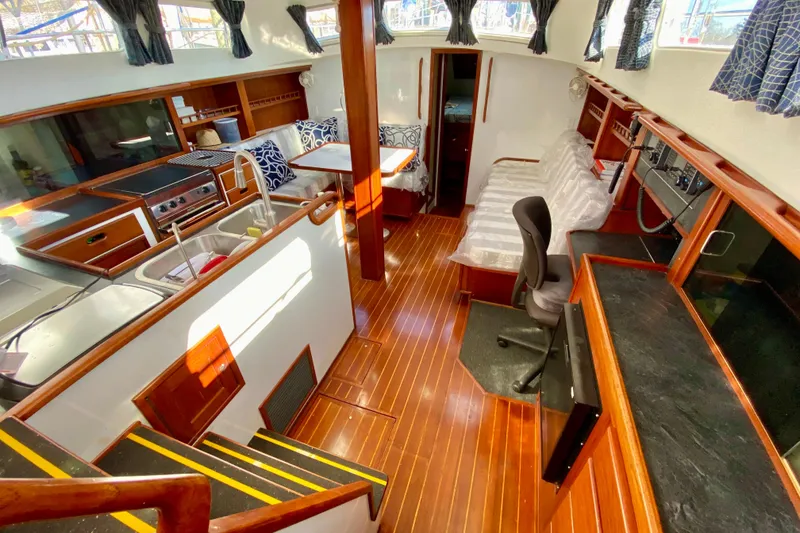 Slide: The Image of Interior of 1980 Wellington 44 yacht with wood flooring and modern amenities. - 32