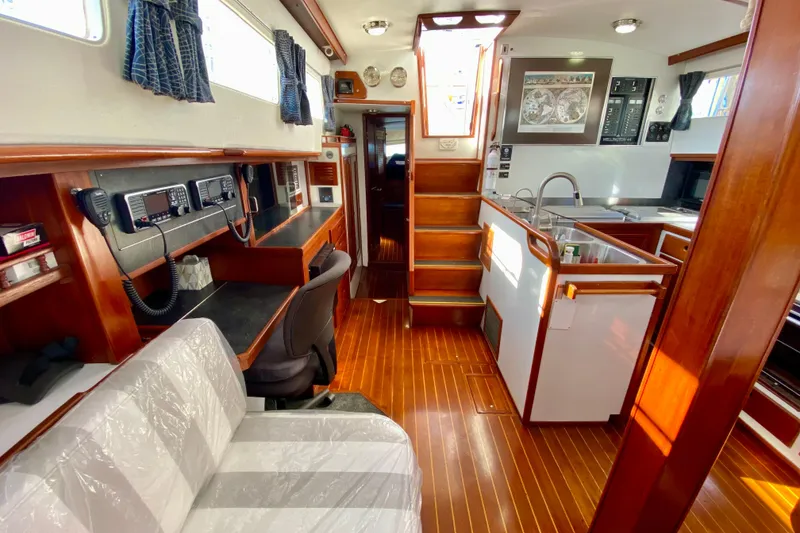 Slide: The Image of Interior of 1980 Wellington 44 yacht with wood finishes and navigation equipment. - 33