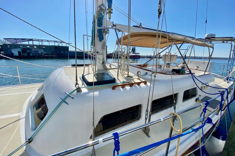 Slide: The Image of Sailboat docked at marina, Wellington 44 model, 1980, with clear blue sky. - 6