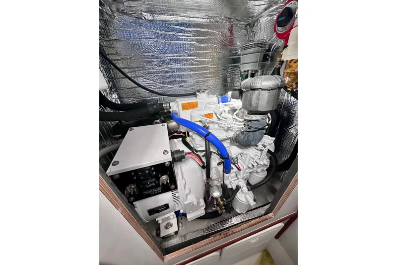 Slide: The Image of Engine compartment of a 1980 Wellington 44, featuring insulated walls and visible components. - 60