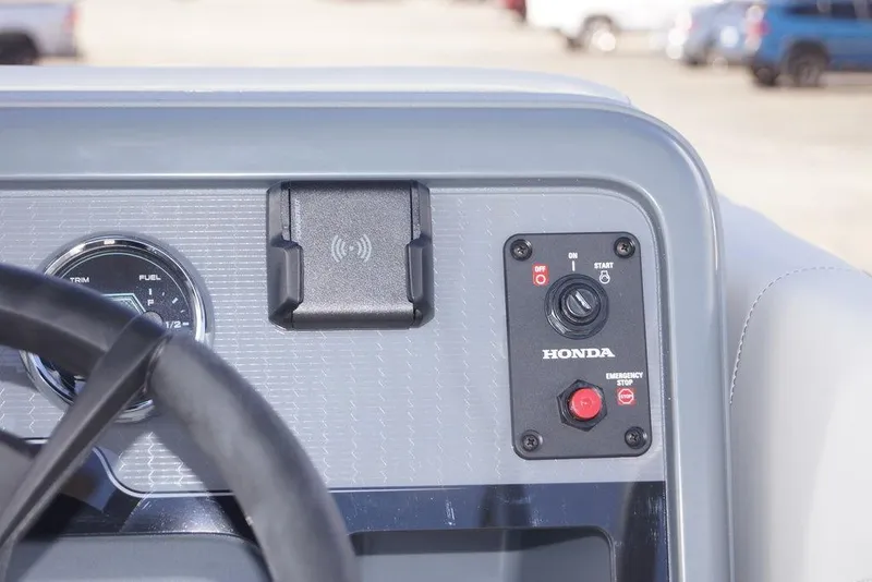 Slide: The Image of Dashboard of 2026 Avalon GS Quad Lounge boat with Honda controls and fuel gauge. - 15