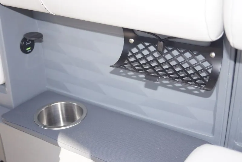 Slide: The Image of 2026 Avalon GS Quad Lounge interior with cup holder and storage net. - 18