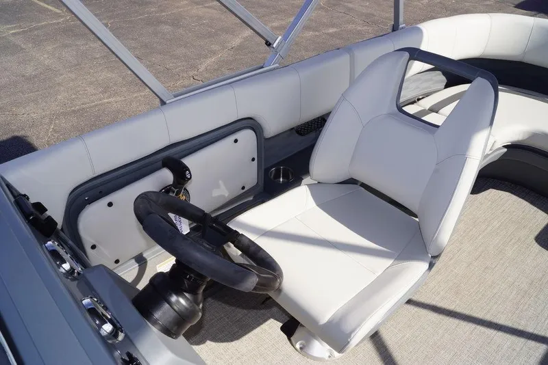 Slide: The Image of 2026 Avalon GS Quad Lounge boat interior with steering wheel and white seating. - 21