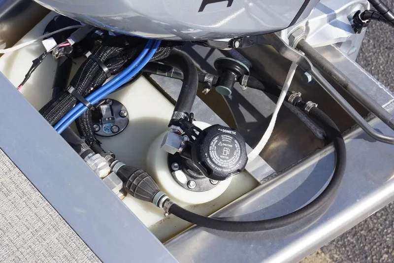 Slide: The Image of Engine compartment of 2026 Avalon GS Quad Lounge boat, showing fuel system components. - 25