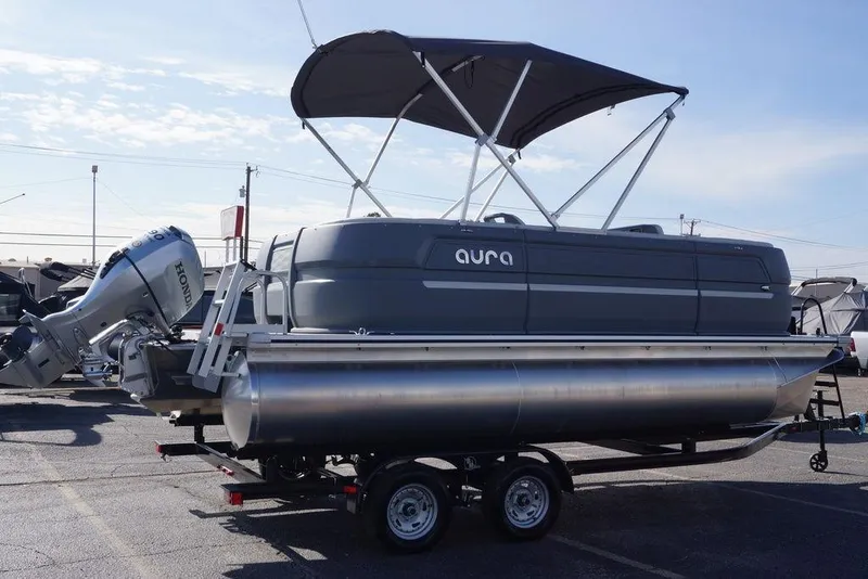 Slide: The Image of 2026 Avalon GS Quad Lounge 18' pontoon boat with Honda motor and canopy on trailer. - 4